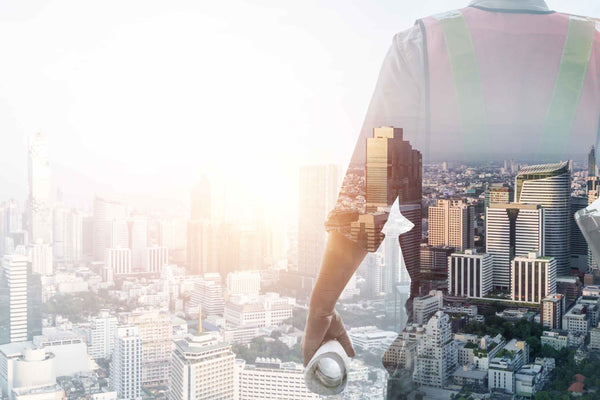 styalised picture of tradie looking over a city