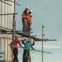 a team of workers on a construction site scaffolding