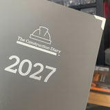 Diary titled 'The Construction Diary 2027' on a blurred background