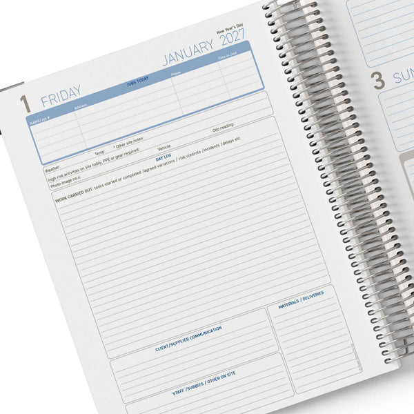 Spiral-bound planner open to a page for January 2027 with daily layout.